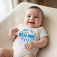 Baby wearing Best Mom Ever onesie