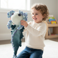 Child playing with teal Ashla