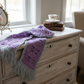 Purple butterfly scarf on dresser