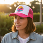 Trucker hat with pink brim and DTF design on white front
